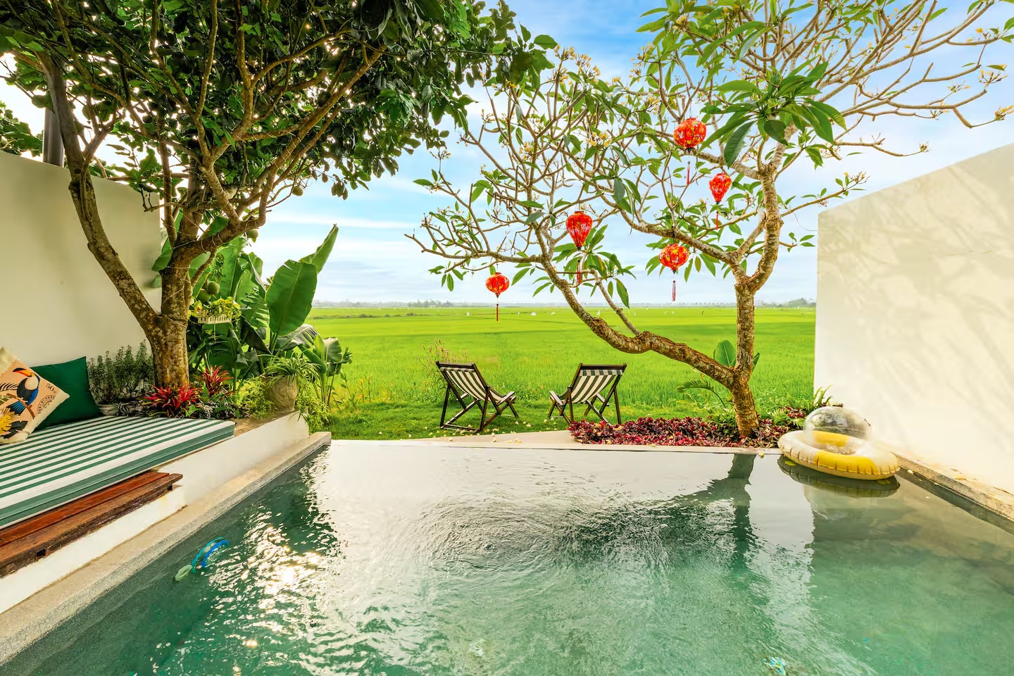 backyard with pool and rice field view of min's house villa 2